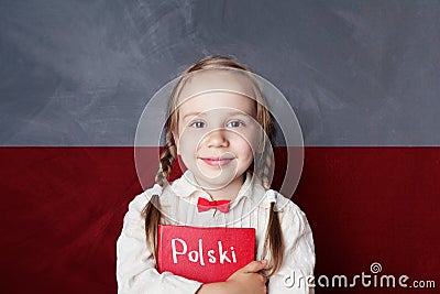 Polish concept with little girl student with book Stock Photo