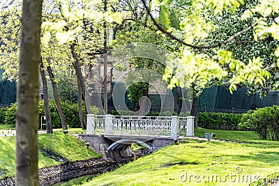 Polish garden at the Derzhavin estate. Gorgeous spring bloom. Pond, bridge Stock Photo