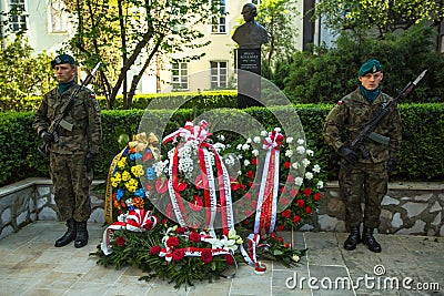 Polish soldiers at ceremony of laying flowers to monument to Hugo Kollataj Editorial Stock Photo