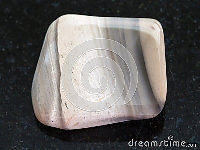 polished flint stone on dark background Stock Photo