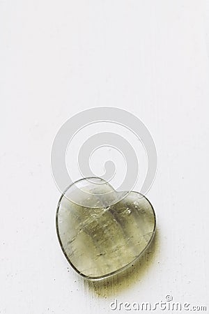 Polished fluorite stone in the shape of a heart on a white background Stock Photo