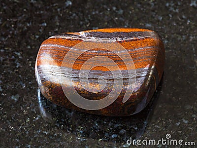 Polished Jaspillite stone on black Stock Photo