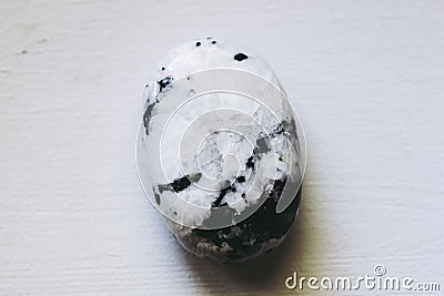 Polished moonstone gemstone on a black background Stock Photo