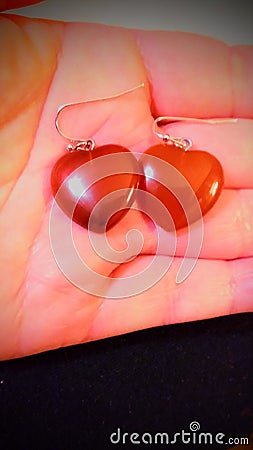 Polished, Shiney Red Heart Dangiling Earrings Stock Photo