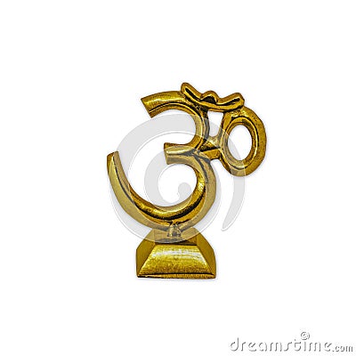 Polished solid brass om sign, with a small base, displayed on a white background Stock Photo