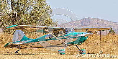 Polished vintage aircraft on grass field Editorial Stock Photo