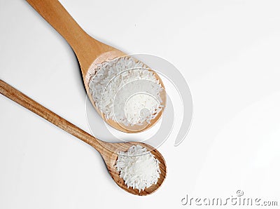 Polished white rice in wooden spoon Stock Photo