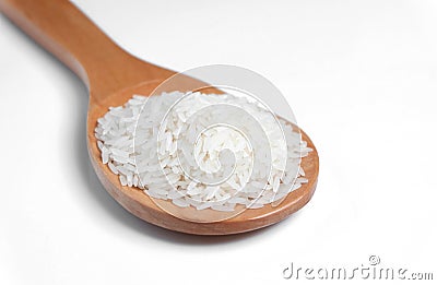 Polished white rice in wooden spoon Stock Photo