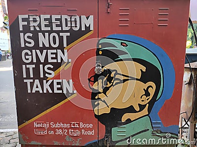 Political graffiti painted on the street wall with Netaji Subhas Chandra Bose and his message on Indian Freedom struggle Editorial Stock Photo