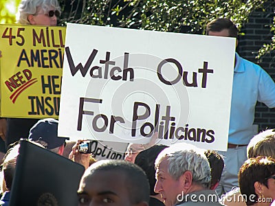 Political Rally with protest sign stating `Watch Out for Politicians` Editorial Stock Photo