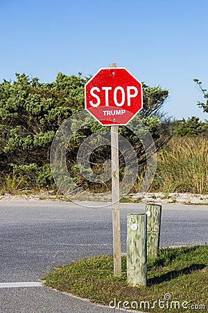 Political Stop Sign in a Park Editorial Stock Photo