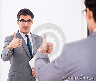 Politician planning speach in front of mirror Stock Photo