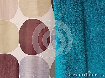 Polka dot shower curtain and green towel Stock Photo