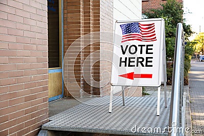 Polling Place Vote Here Sign On Board Stock Photo