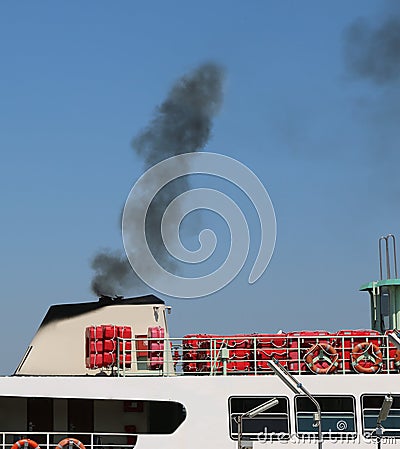 polluted black smog of a boat Editorial Stock Photo