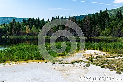 Polluted lake with kaolin on abandoned quarry with beautiful blue sky Stock Photo