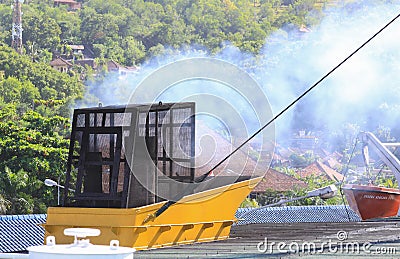 Pollution by engine exhaust of ferry in Indonesia Editorial Stock Photo