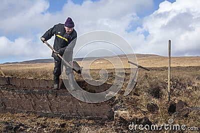 Cutting turf in Ireland Editorial Stock Photo