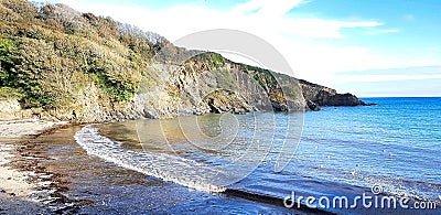 Polridmouth Beach is set in an attractive, sheltered cove to the east of Gribbin Head , Cornwall Stock Photo