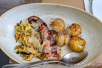 polvo a lagareiro grilled octopus popular food in portugal Porto on a dish in a restaurant Stock Photo