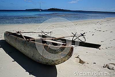 Polynesian canoe on beach Stock Photo