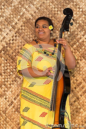 Polynesian woman playing sting instrument Editorial Stock Photo