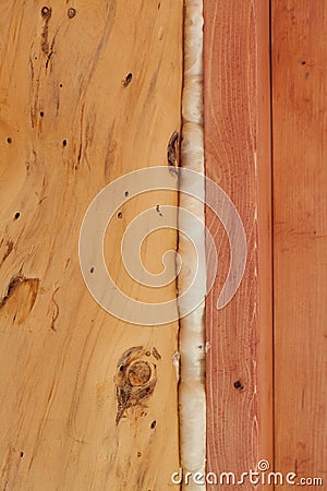 Polyurethane foam seals gap in wood construction Stock Photo