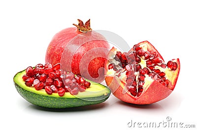 Pomegranate, avocado, pomegranate seeds on white background Stock Photo