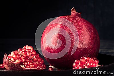 Pomegranate fruit grain red Still life rural rustic style Stock Photo