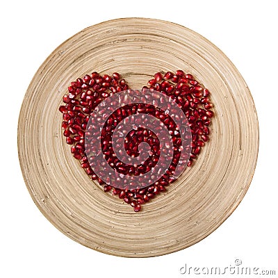 Pomegranate heart on white background Stock Photo