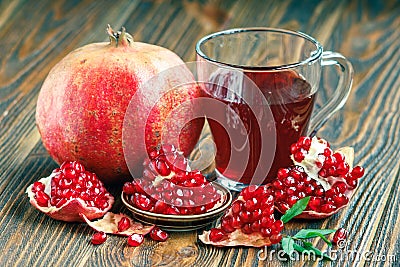 Pomegranate juice with ripe fresh punica granatum fruits Stock Photo