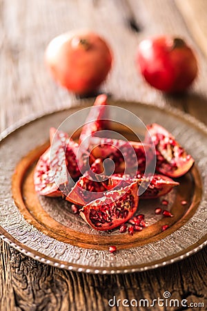 Pomegranate. Pieces of frest pomegranate on plate Stock Photo