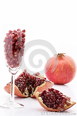 Pomegranate seeds and a whole Punica granatum Stock Photo