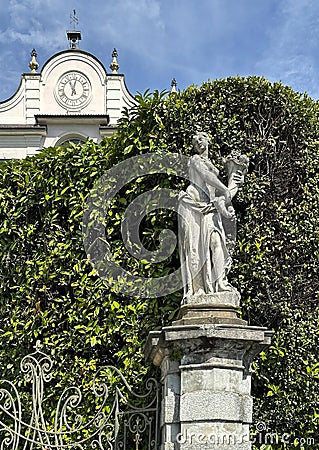 Pomona, one of 12 statues of mythical divinities and allegorical figures on the front of the Italian garden of Villa Carlotta. Editorial Stock Photo
