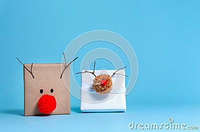 Pompom reindeer gift boxes Stock Photo