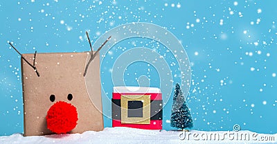 Pompom reindeer and santa belt gift boxes Stock Photo