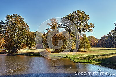 Pond and trees in the garden of the Muskauer park during autumn Stock Photo