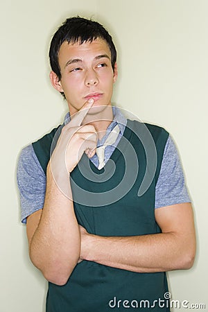 Pondering young man Stock Photo