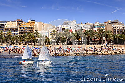 Poniente beach in Benidorm with two boats sailing to the bay Editorial Stock Photo