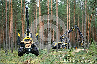 Ponsse Forwarder and Harvester Working in Forest Editorial Stock Photo