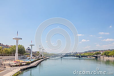 Pont de l`Universite bridge in Lyon, France over a panorama of the riverbank of the Rhone river Quais de Rhone Stock Photo