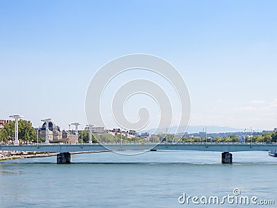 Pont de la Guillotiere bridge in Lyon, France over a panorama of the riverbank of the Rhone river Quais de Rhone Stock Photo