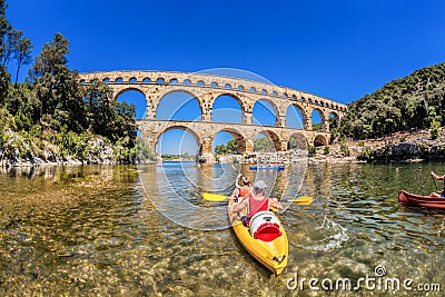 Pont du Gard with paddle boats is an old Roman aqueduct in Provence, France Editorial Stock Photo