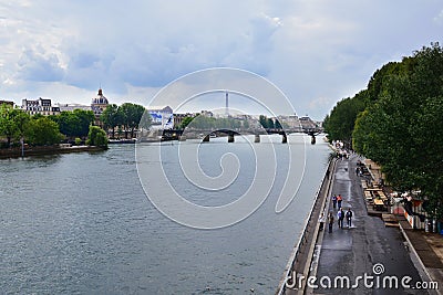 The Pont Neuf is, despite its name, the oldest existing bridge in Paris. In the background, the Eiffel Stock Photo