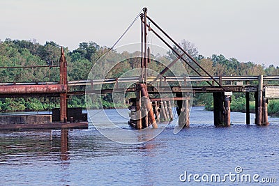 Pontoon Bridge in Henderson Louisiana, which leads to Butte Larose Over the Levee Stock Photo