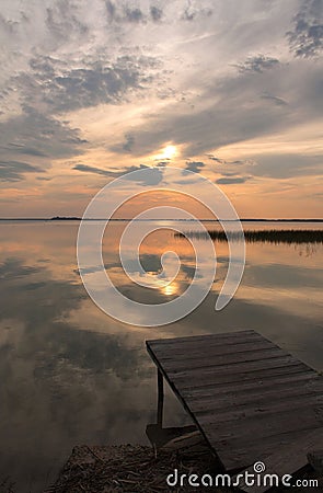 Pontoon on the lake at the sunset time Stock Photo