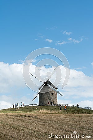 Tourists visit the famous and historic Moidrey Windmill near Le Mont Saint-Michel in France Editorial Stock Photo