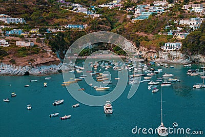 Ponza Island, Italy - 27 July 2019: View of little harbor of Ponza island in the summer season with typical colored houses and Editorial Stock Photo