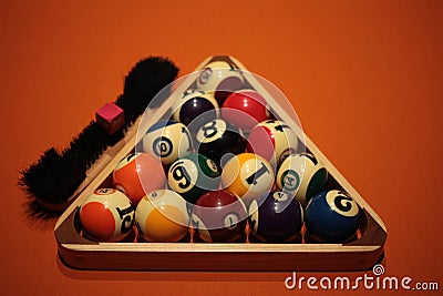 Pool balls pyramid on orange cloth for eightball game Stock Photo