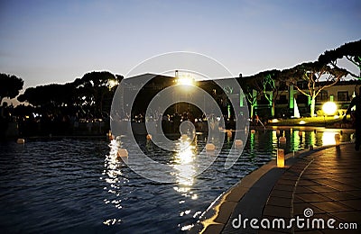 Pool Candles, Night Scene, Dusk Dinner Party Stock Photo